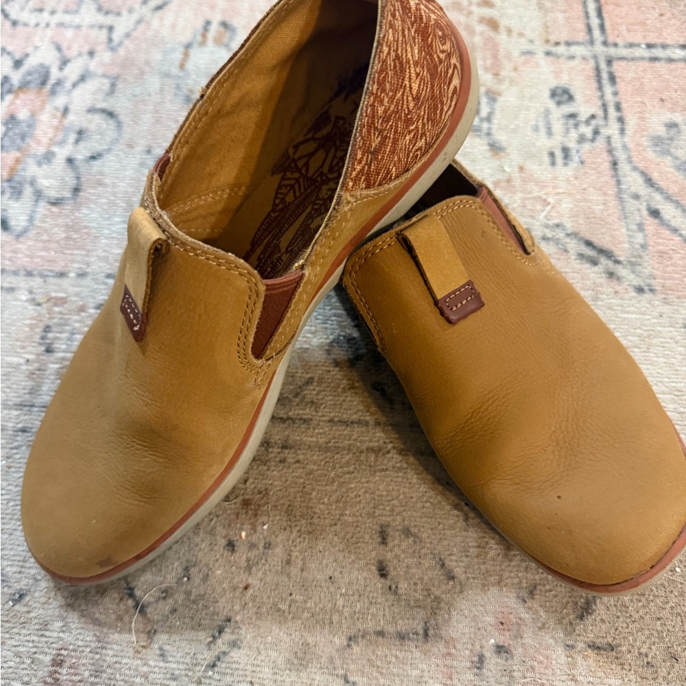 Merrell Duskair Wmns "Brown Sugar" suede and fabric sneaker slip-ons.